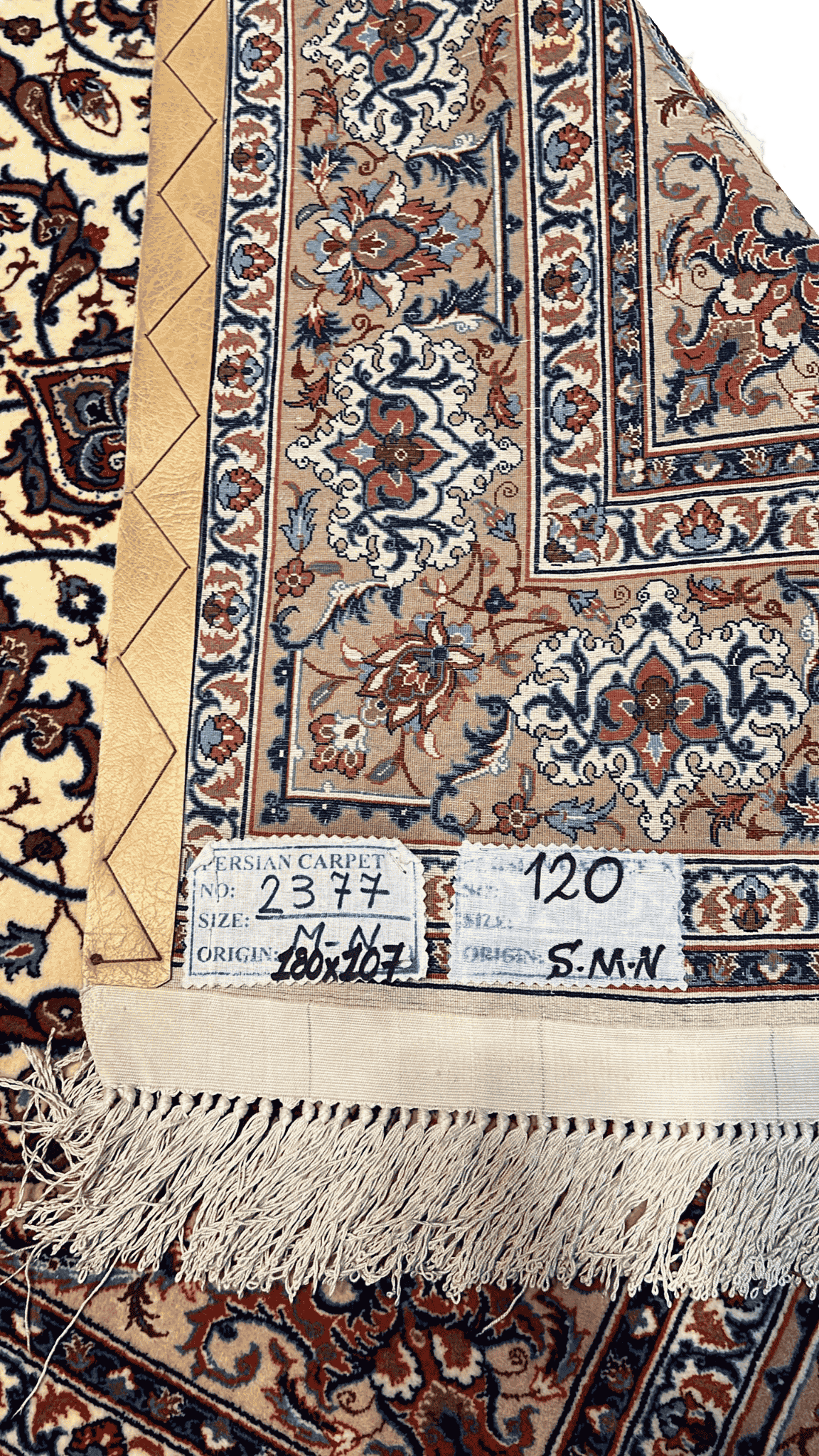 "Backside of a Master Bagher Seirafian hand-knotted Persian rug, showcasing fine knot craftsmanship with a silk warp and wool pile, made in Isfahan."
